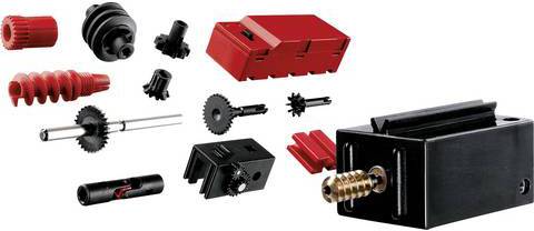 Mehrere schwarze und rote Lego-Technik-Teile, darunter Zahnräder, Pfeifenelemente und ein Motorblock, auf hellem Hintergrund.
