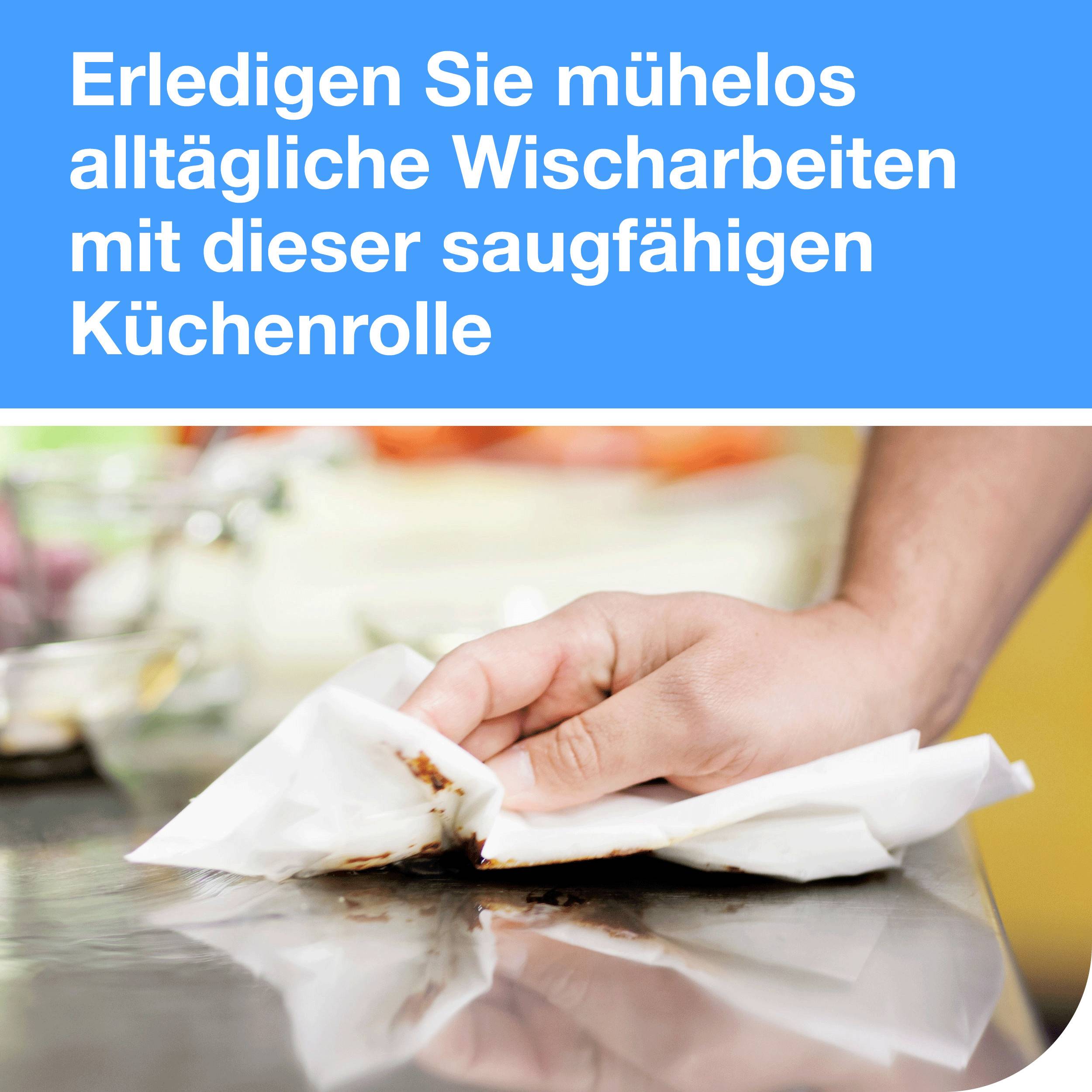 'Eine Hand wischt einen Tisch mit einer Küchenrolle ab.' Text oben: 'Erledigen Sie mühelos alltägliche Wischarbeiten mit dieser saugfähigen Küchenrolle.'