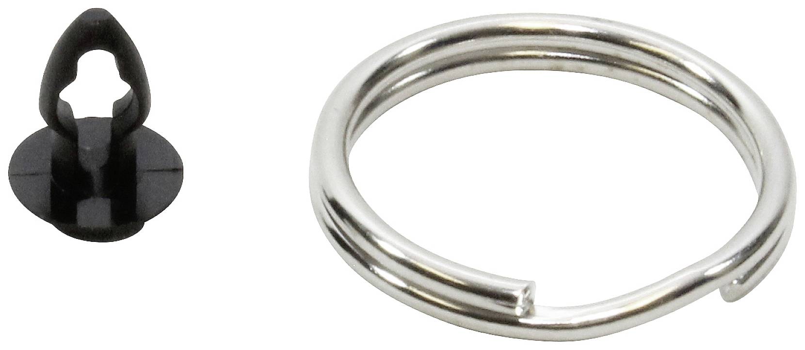 Ein silberner Ring und ein kleiner, schwarzer Kunststoffclip, separat nebeneinander platziert.