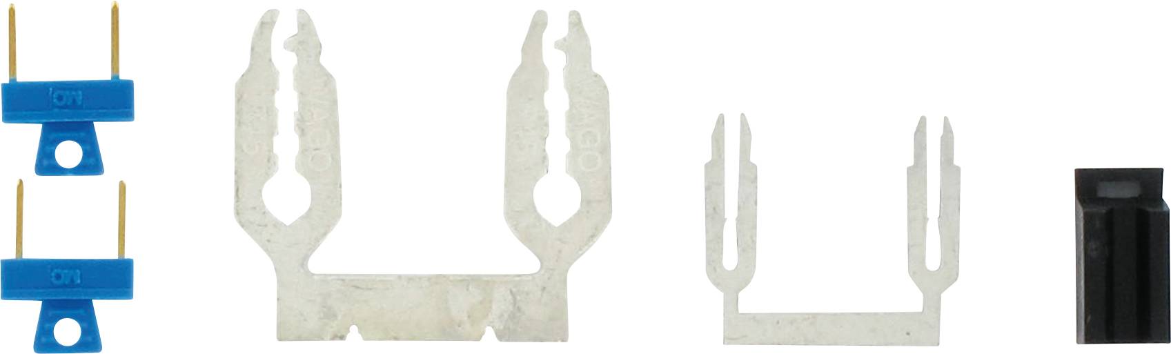 Elektronische Bauteile: Zwei blaue PIN-Verbinder links, zwei metallische Kontakte in der Mitte, ein schwarzer Verbinder rechts.