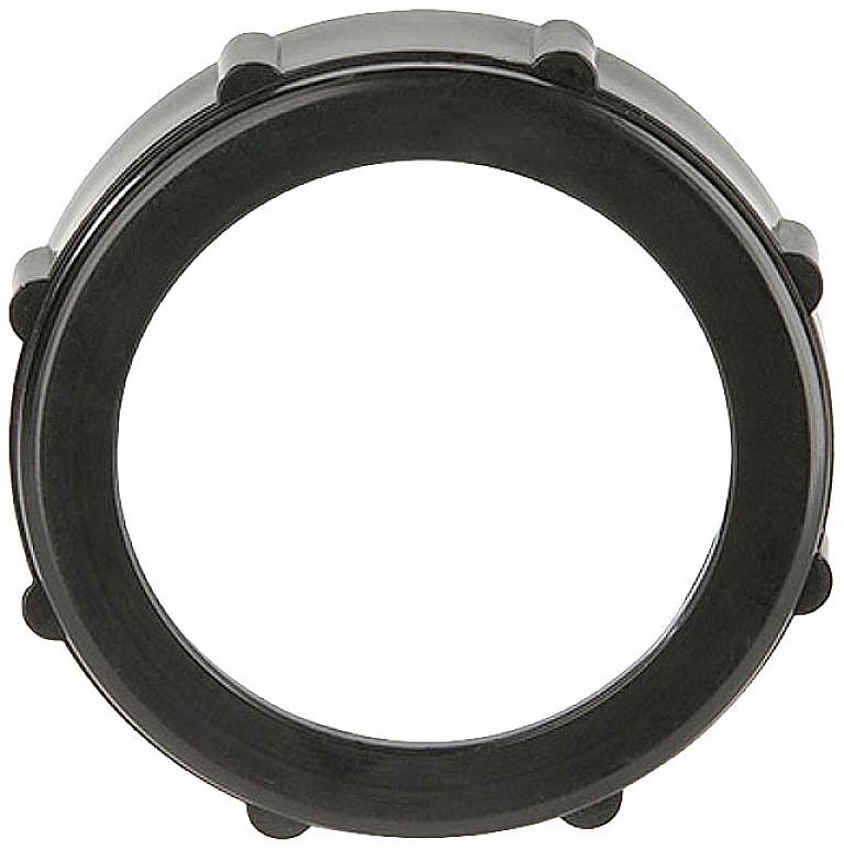 Ein schwarzer Kunststoffring mit mehreren kurzen, abgerundeten Noppen entlang des äußeren Randes.