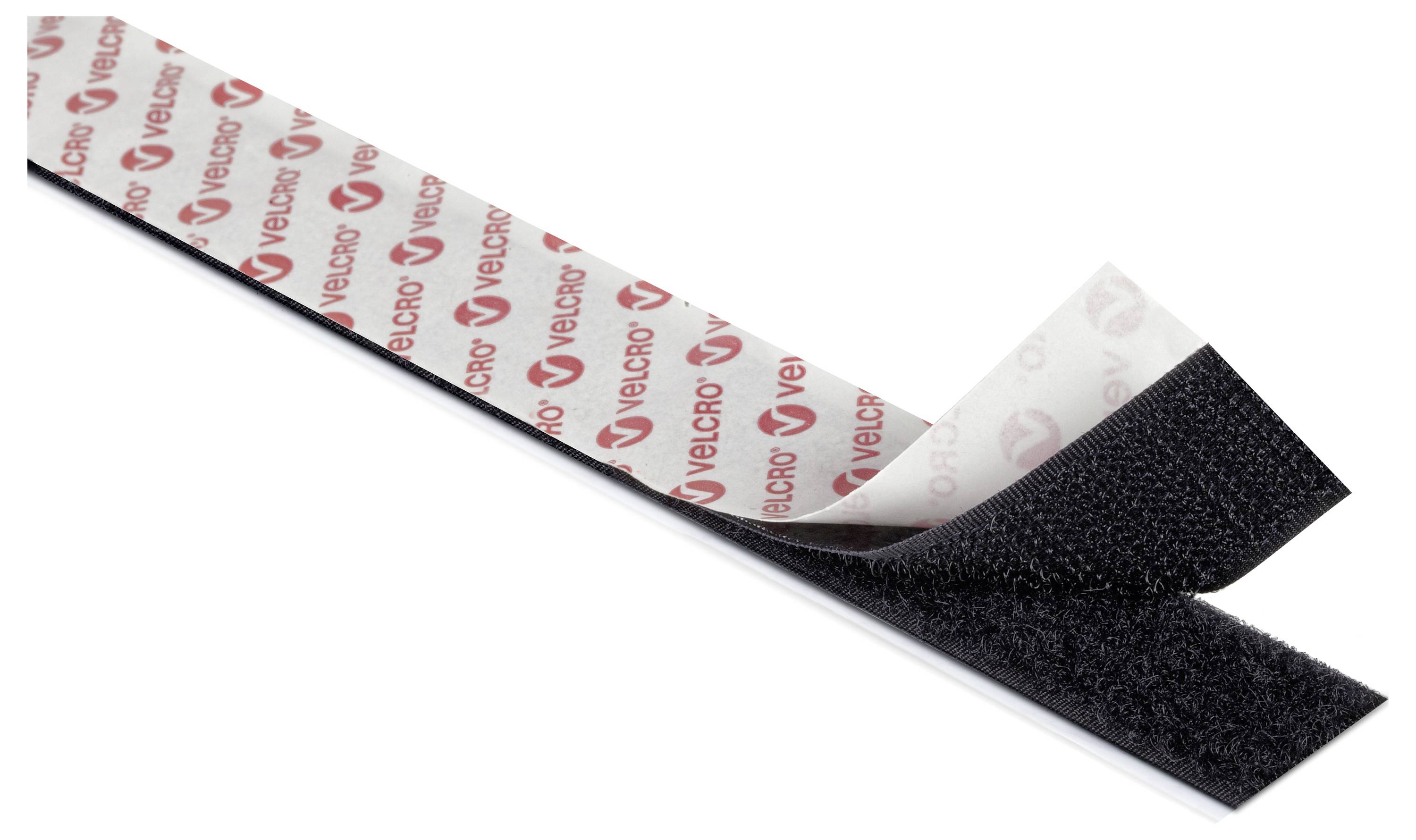 Ein Stück Klettband mit Hook- und Loop-Seiten teilweise getrennt, zeigt die strukturierte Hook-Oberfläche und das markierte Rückenteil.