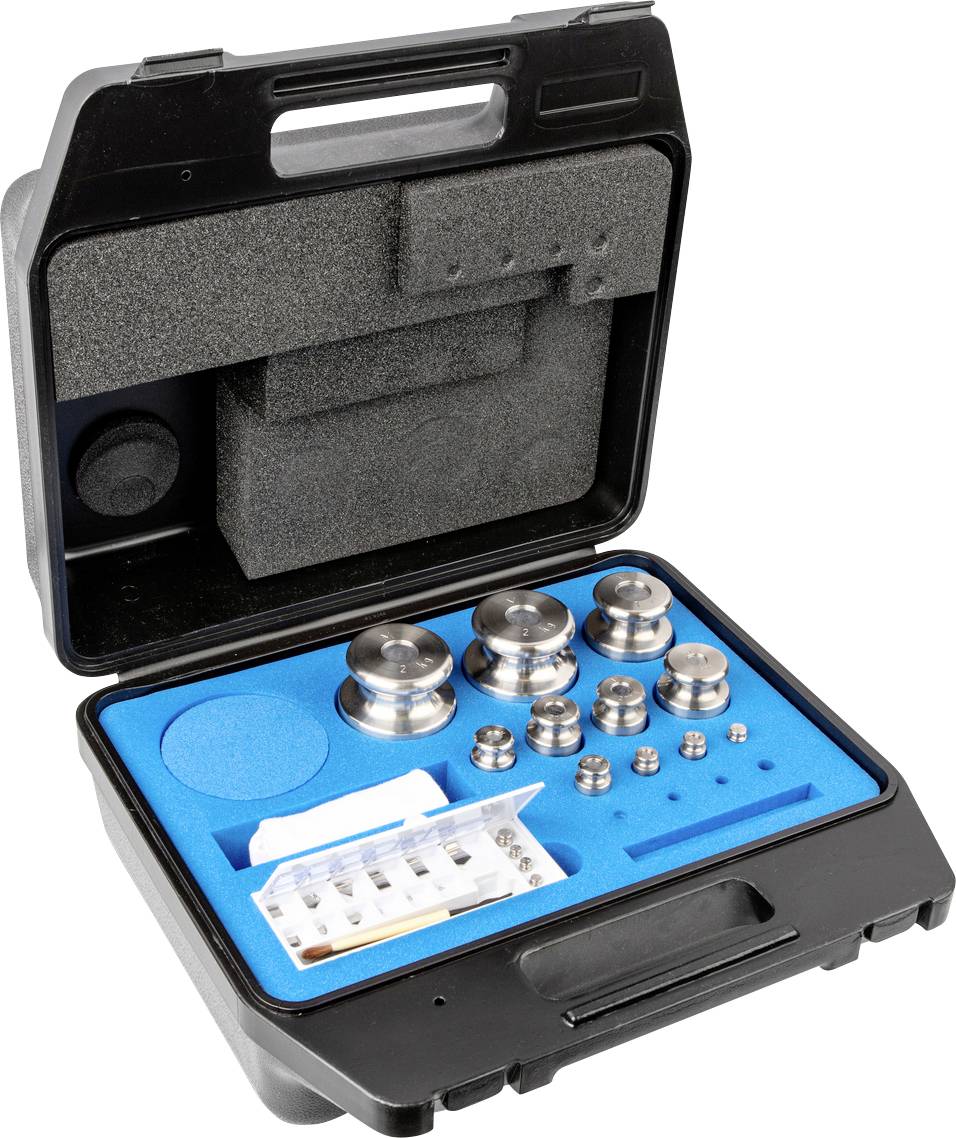 Ein offener schwarzer Koffer mit verschiedenen Metallhohlgewichten unterschiedlicher Größe, die in einem blauen Schaumstoffeinsatz liegen.