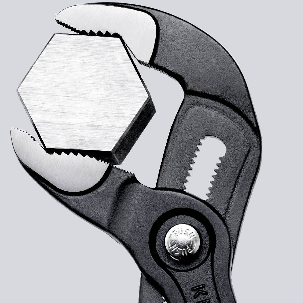 Eine verstellbare Zange hält einen sechseckigen Metallbolzen. Die Zange ist griffig und scheint für Arbeiten an Metallstücken geeignet zu sein.