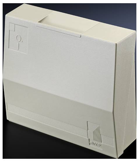 Ein beige-grauer, kastenförmiger Computer oder Elektronikgehäuse, möglicherweise aus den 1980er Jahren, mit minimalem Design.