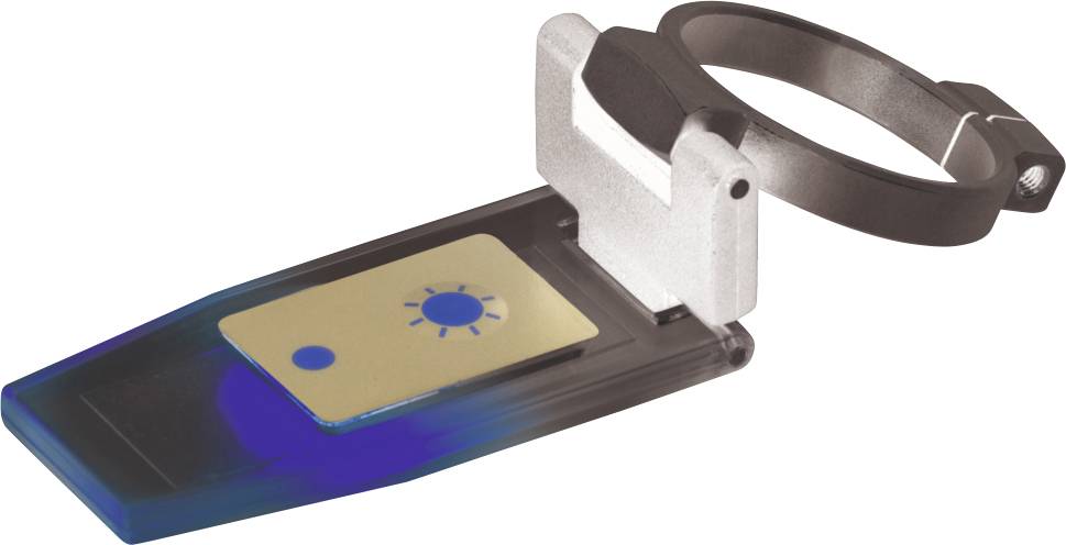 Ein tragbarer Lichtsensor, montiert an einem Armband, zeigt eine stilisierte Sonne auf seiner Oberfläche.