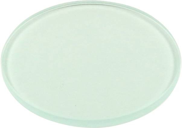 Eine leere, transparente, runde Glasscheibe liegt auf einem flachen Untergrund.