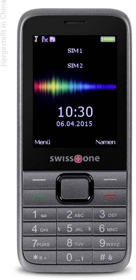 Ein einfaches Mobiltelefon mit Tasten und kleinem Bildschirm. Anzeige: Datum '06.04.2015', Uhrzeit '10:30'.