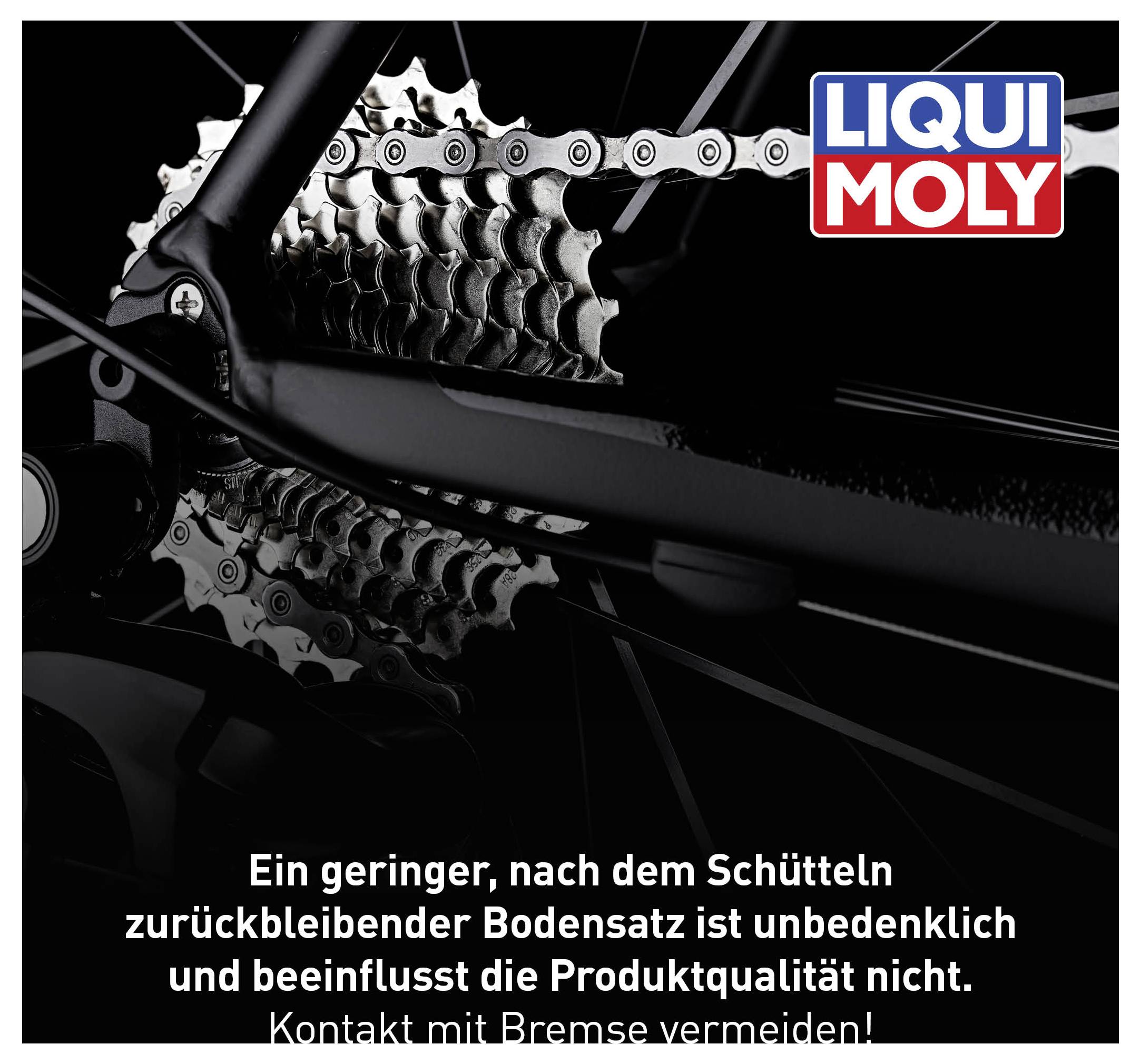 Ein Fahrradantrieb mit LIQUI MOLY-Logo. Text: 'Ein geringer, nach dem Schütteln zurückbleibender Bodensatz ist unbedenklich und beeinflusst die Produktqualität nicht. Kontakt mit Bremse vermeiden!'