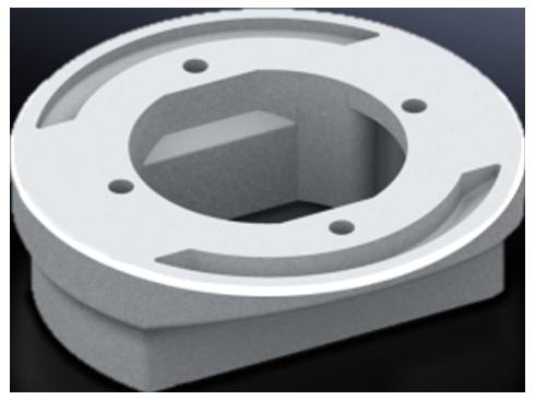 Ein metallisches Maschinenteil mit mehreren Löchern und einer zentralen Aussparung, das auf einer dunklen Oberfläche liegt.