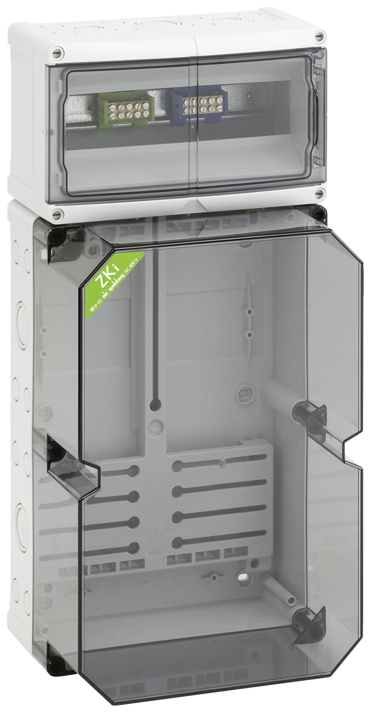 Elektrischer Schaltschrank mit zwei durchsichtigen Abdeckungen, einem grünen Aufkleber mit Aufschrift 2K und innenliegenden Anschlüssen.
