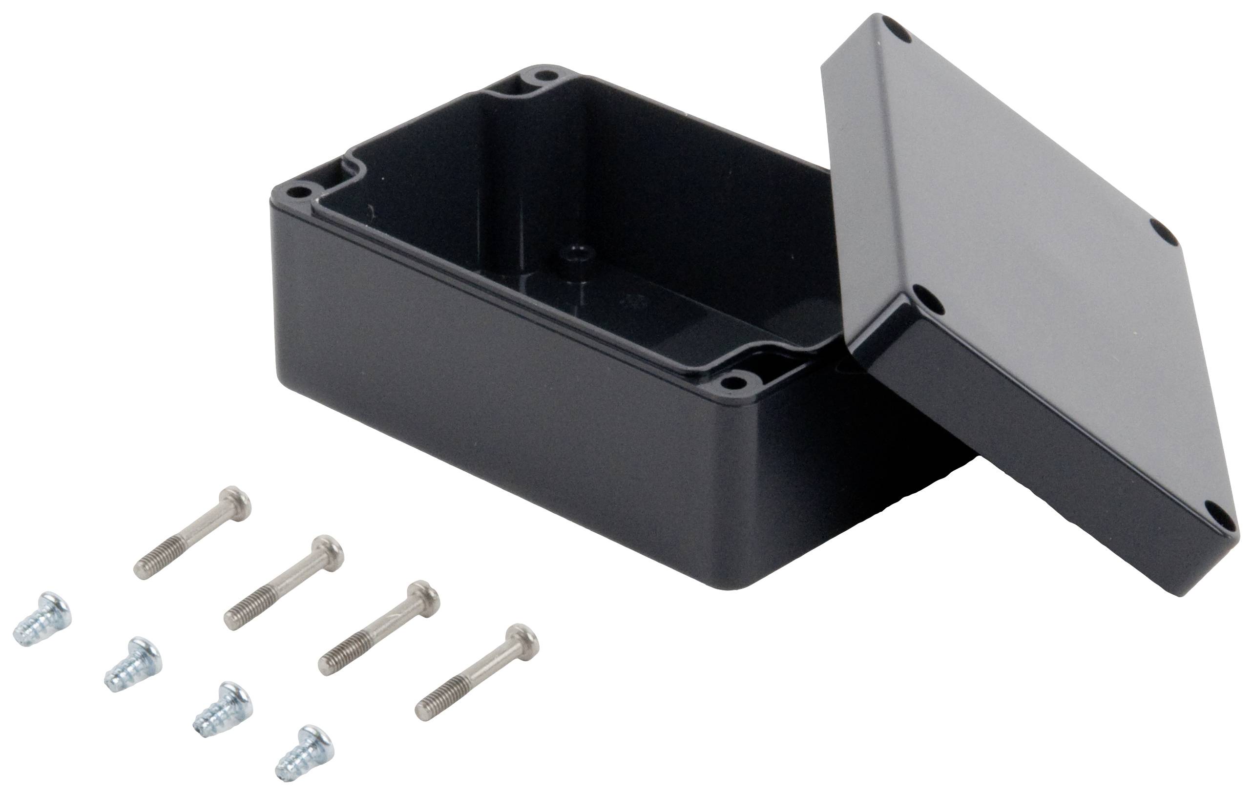 Schwarzes rechteckiges Gehäuse aus Kunststoff mit abgenommenem Deckel, daneben sechs Befestigungsschrauben.