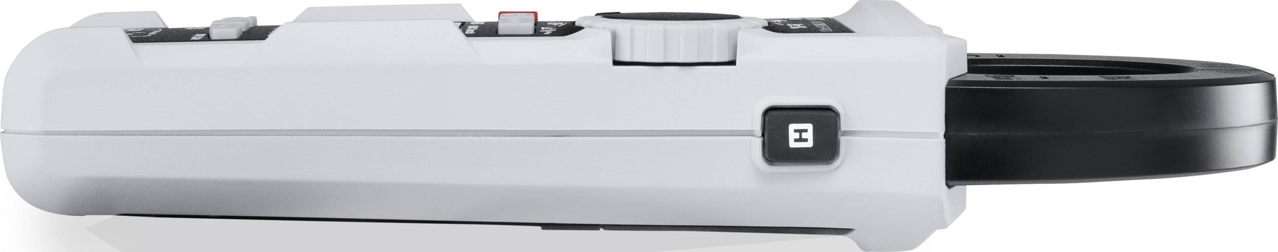 Ein grauer digitaler Handscanner mit schwarzem Lesekopf und Bedienelementen, unter anderem ein großer Drehknopf oben auf dem Gerät.