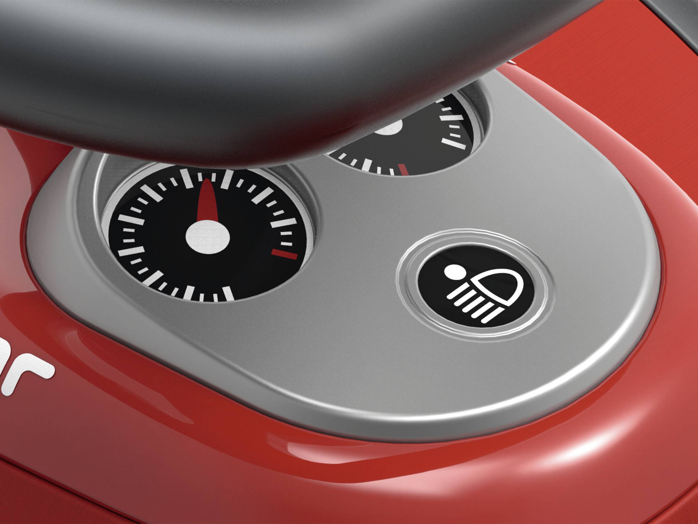 Ein rotes Armaturenbrett mit zwei Anzeigen und einem Scheinwerfer-Symbol. Die Anzeigen zeigen Messwerte mit Zeigern.