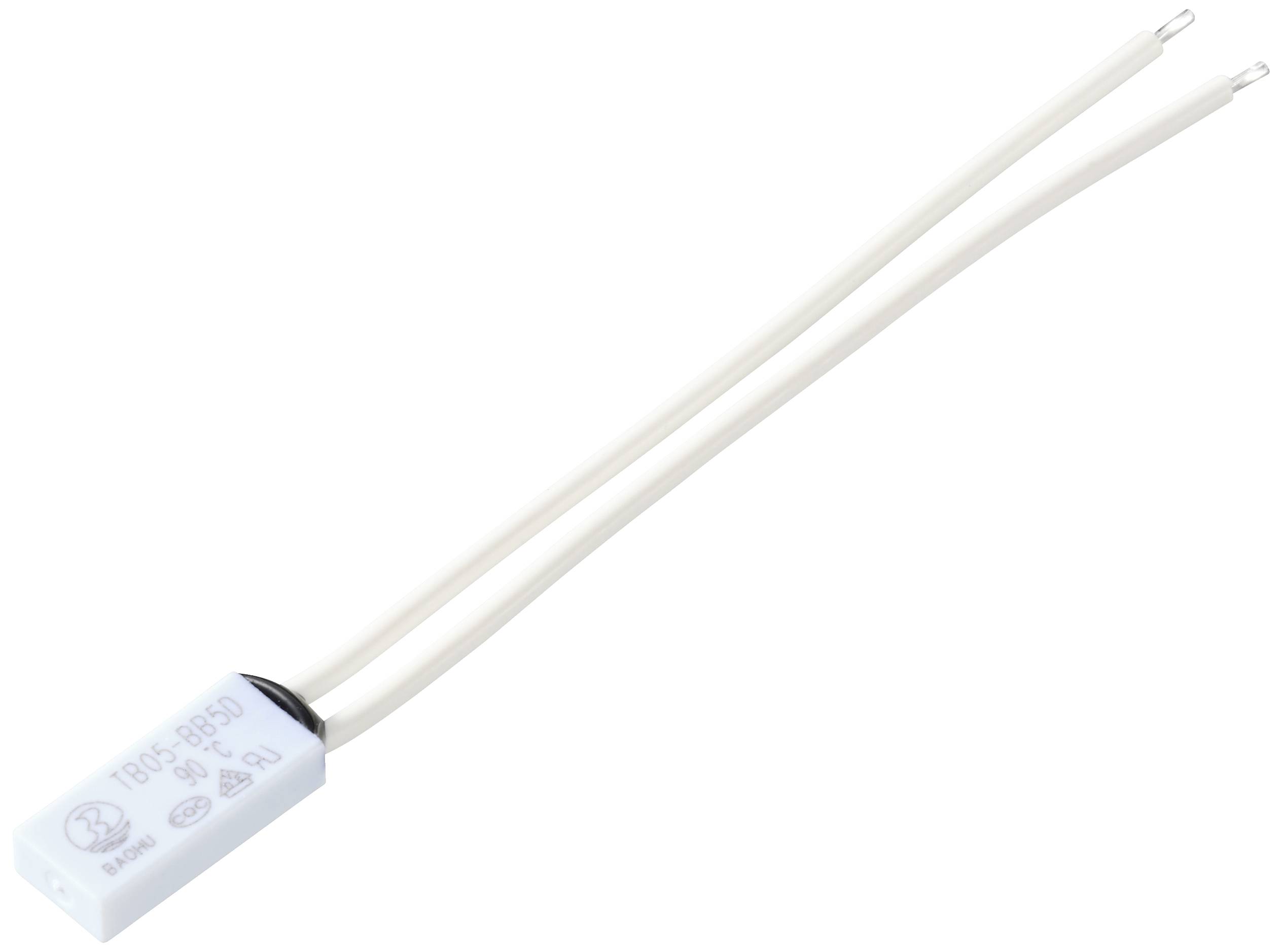 Ein weißer elektrischer Kondensator mit zwei langen Anschlussdrähten liegt auf einer weißen Fläche.