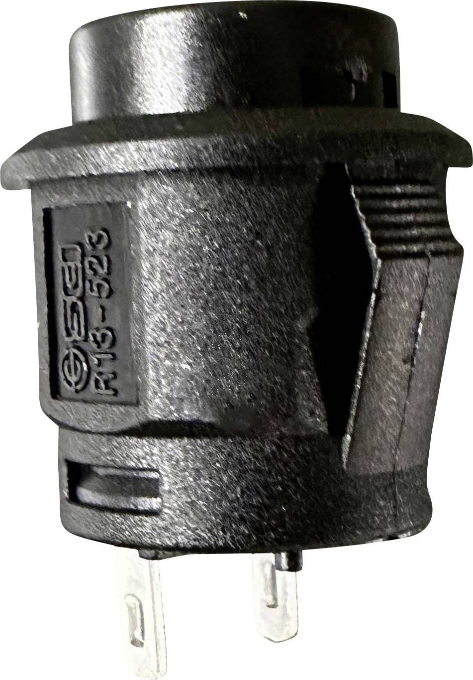 Schwarzer Steckverbinder mit zwei sichtbaren Metallpins und einer seitlichen Griffmulde. Angeschrieben ist 'F13-523'.