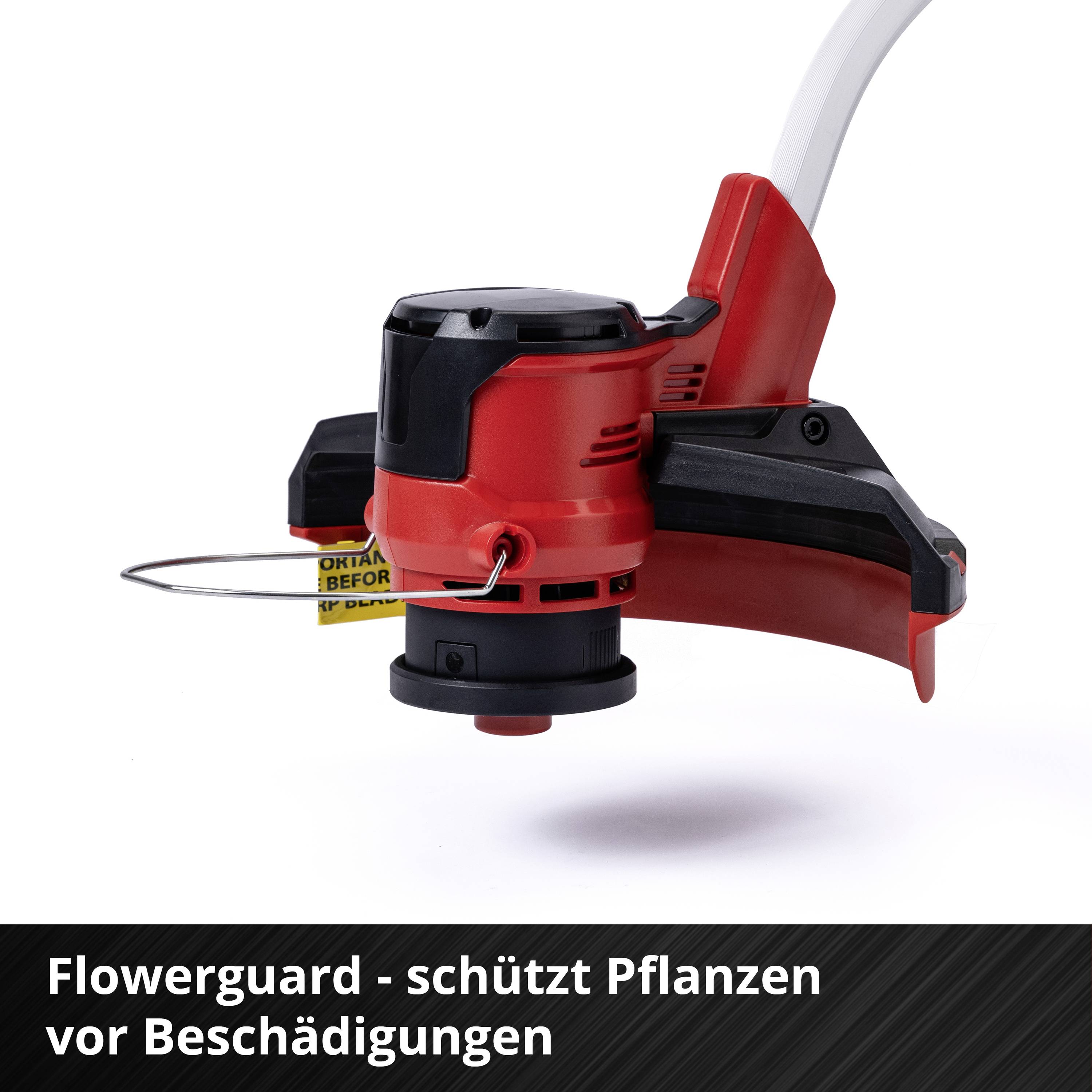 'Flowerguard - schützt Pflanzen vor Beschädigungen' Ein roter Rasentrimmerkopf mit Schutzvorrichtung und Trimmerfaden.