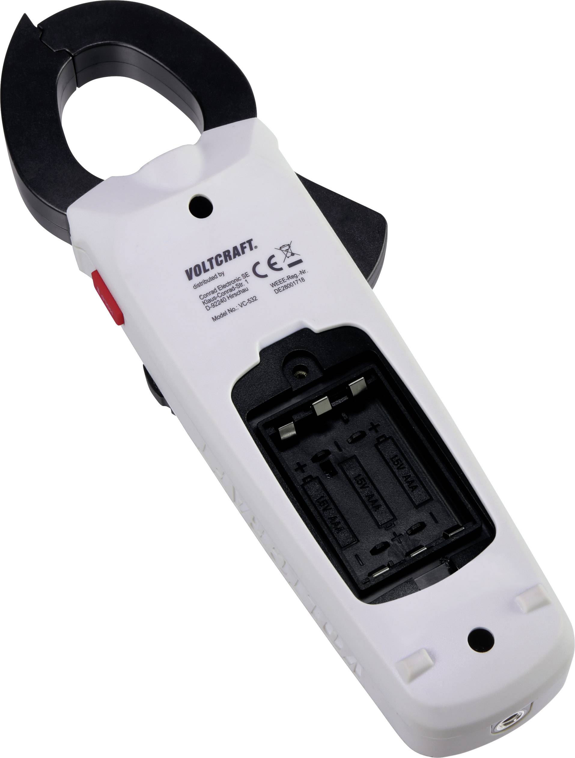 Ein elektrisches Messgerät mit geöffnetem Batteriefach, gekennzeichnet mit 'Voltcraft'. Batteriefach für zwei AA-Batterien sichtbar.