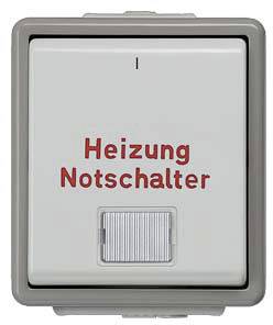 Ein weißer Schalter mit rotem Text 'Heizung Notschalter', darauf befindet sich eine kleine Kontrollleuchte.