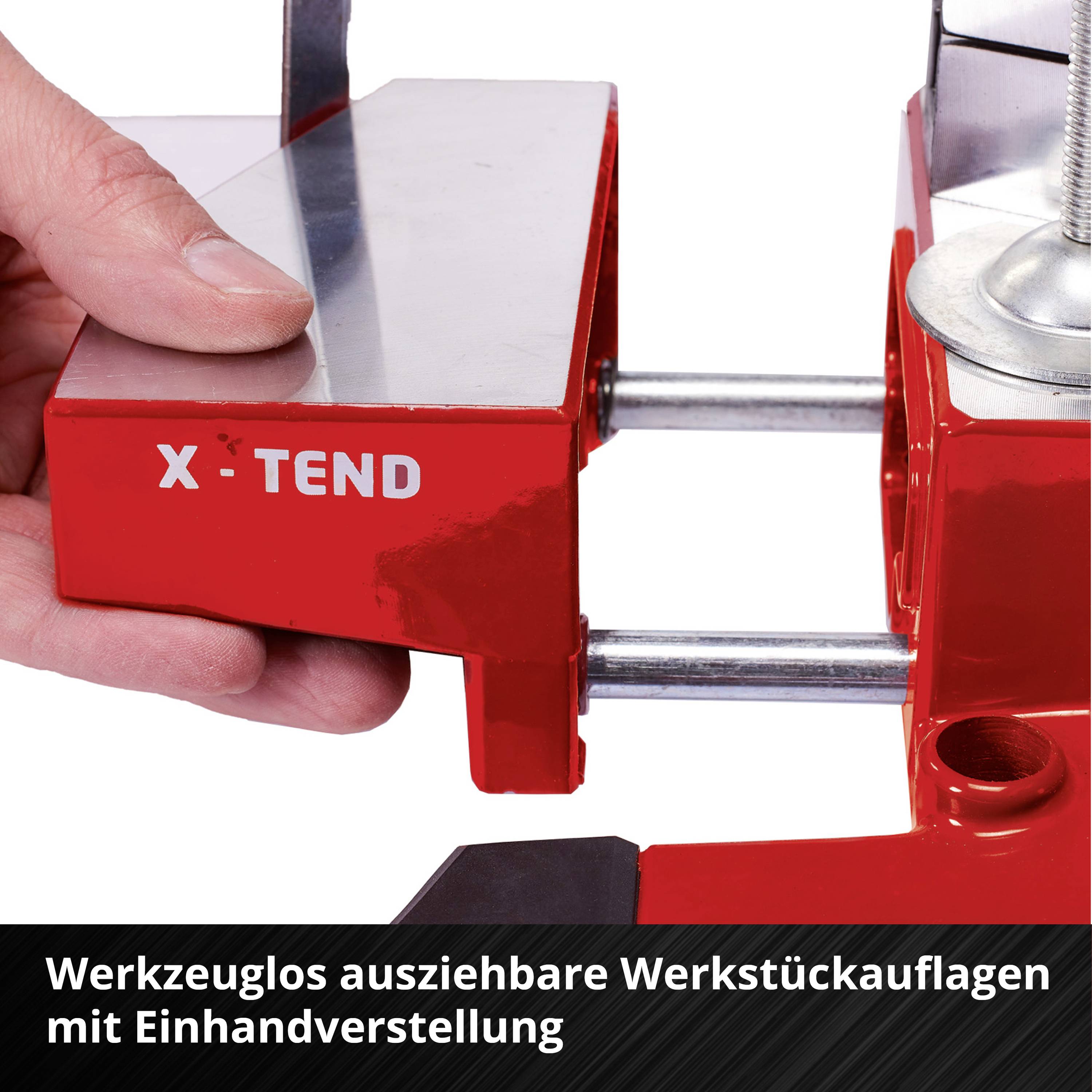 Rote, werkzeuglos ausziehbare Werkstückauflage der Marke X-Tend in einer Werkstattumgebung.