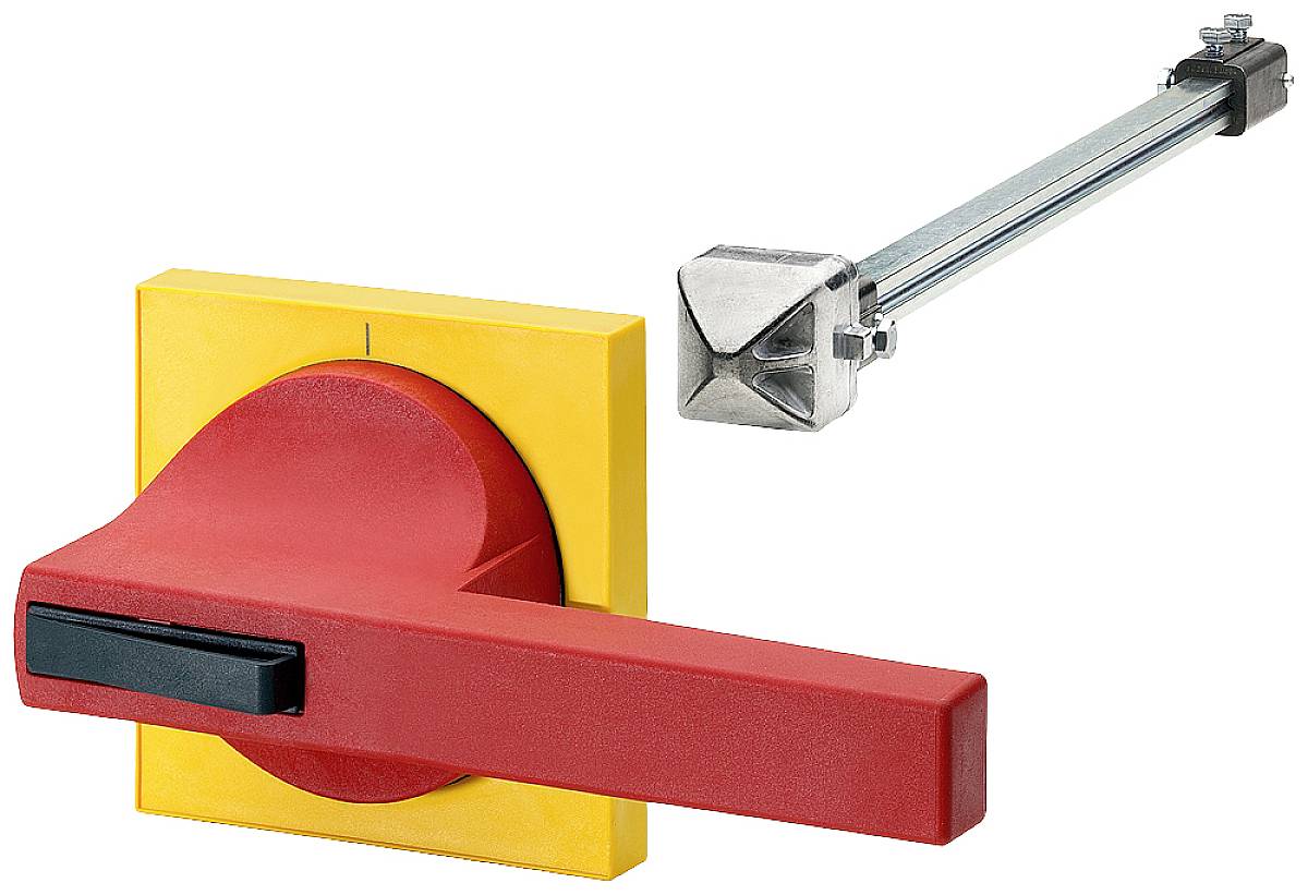 Ein roter Not-Aus-Schalter auf einer gelben Platte, neben einem Stahlstangenmechanismus.