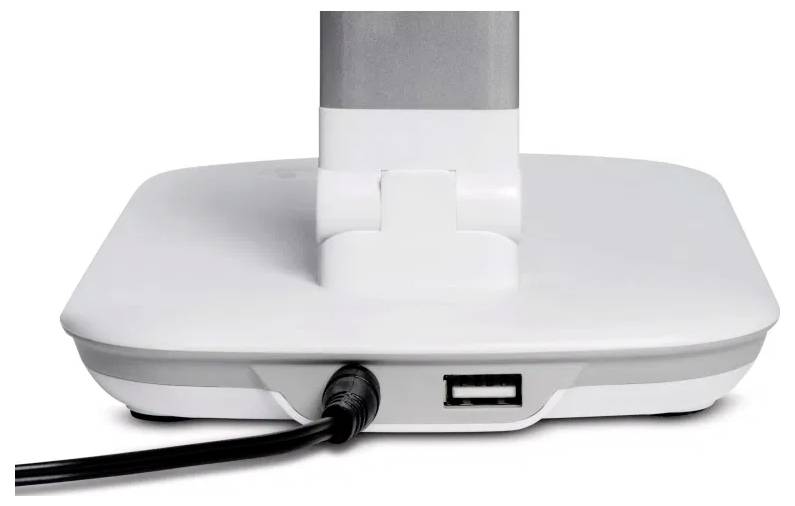Basis eines weißen Monitorständers mit einem angebrachten Stromkabel und einem USB-Anschluss auf der Rückseite.