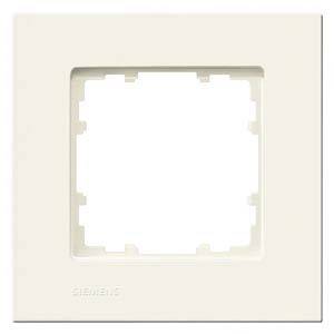 Eine beige Lichtschalterabdeckung von Siemens, quadratisch mit abgerundeten Ecken, zum Einbau über Schaltern oder Steckdosen.