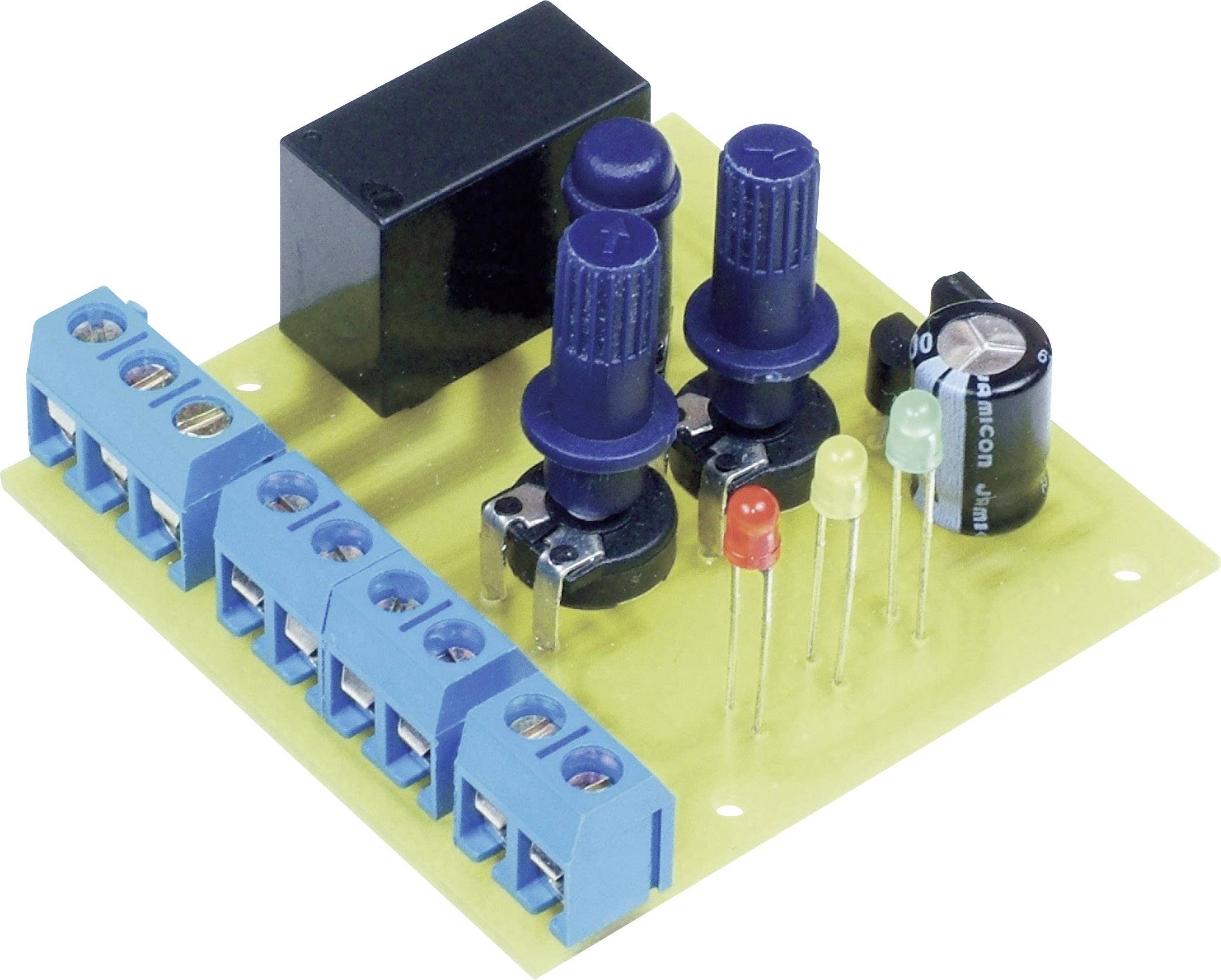 Eine elektronische Schaltung mit verschiedenen Komponenten wie Widerständen, Kondensatoren und LEDs auf einer gelben Leiterplatte.