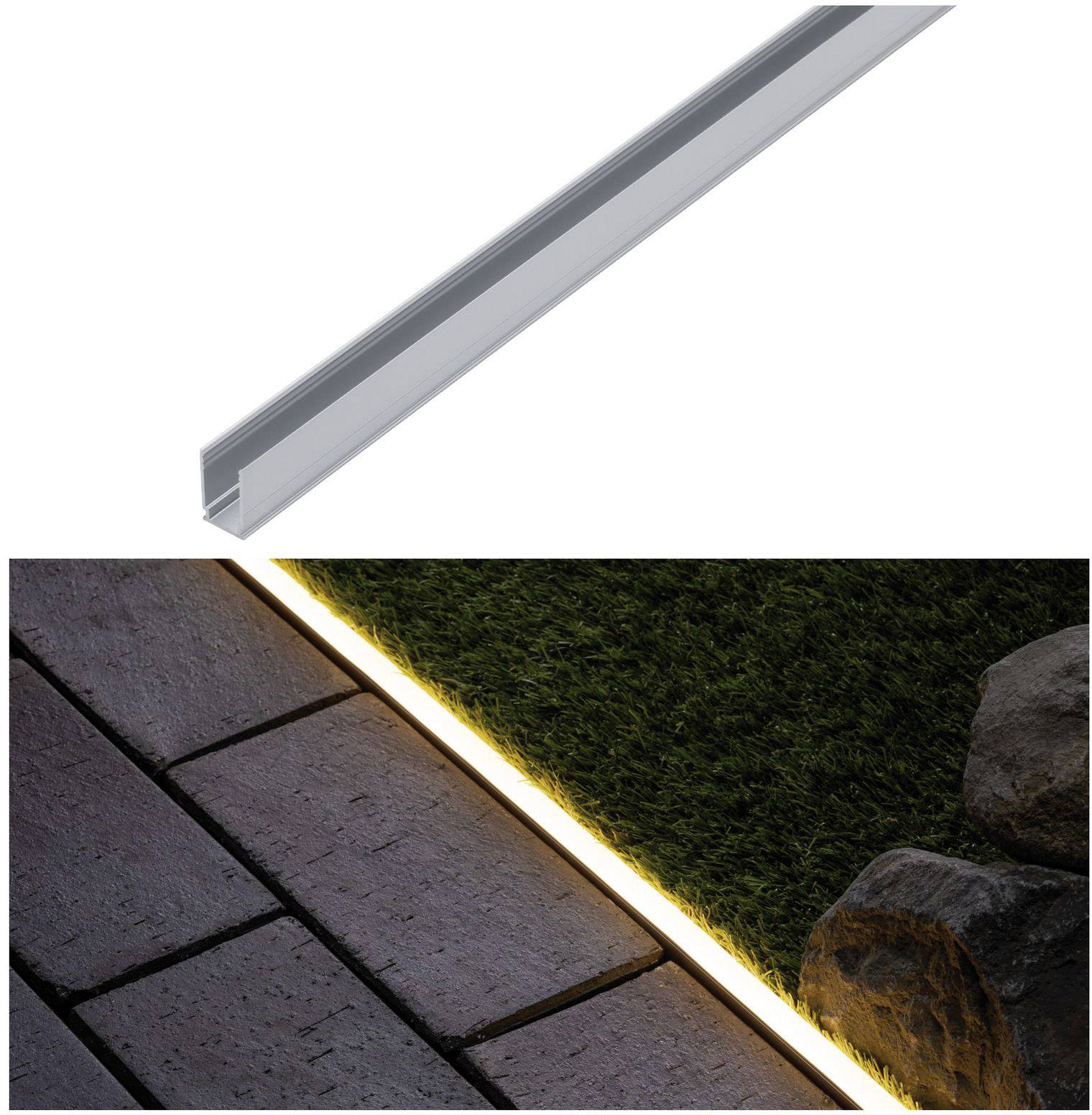 Aluminiumprofil neben einem beleuchteten Gehweg. Uplight beleuchtet den Gehsteig und hebt die Struktur von Steinen und Rasen hervor.