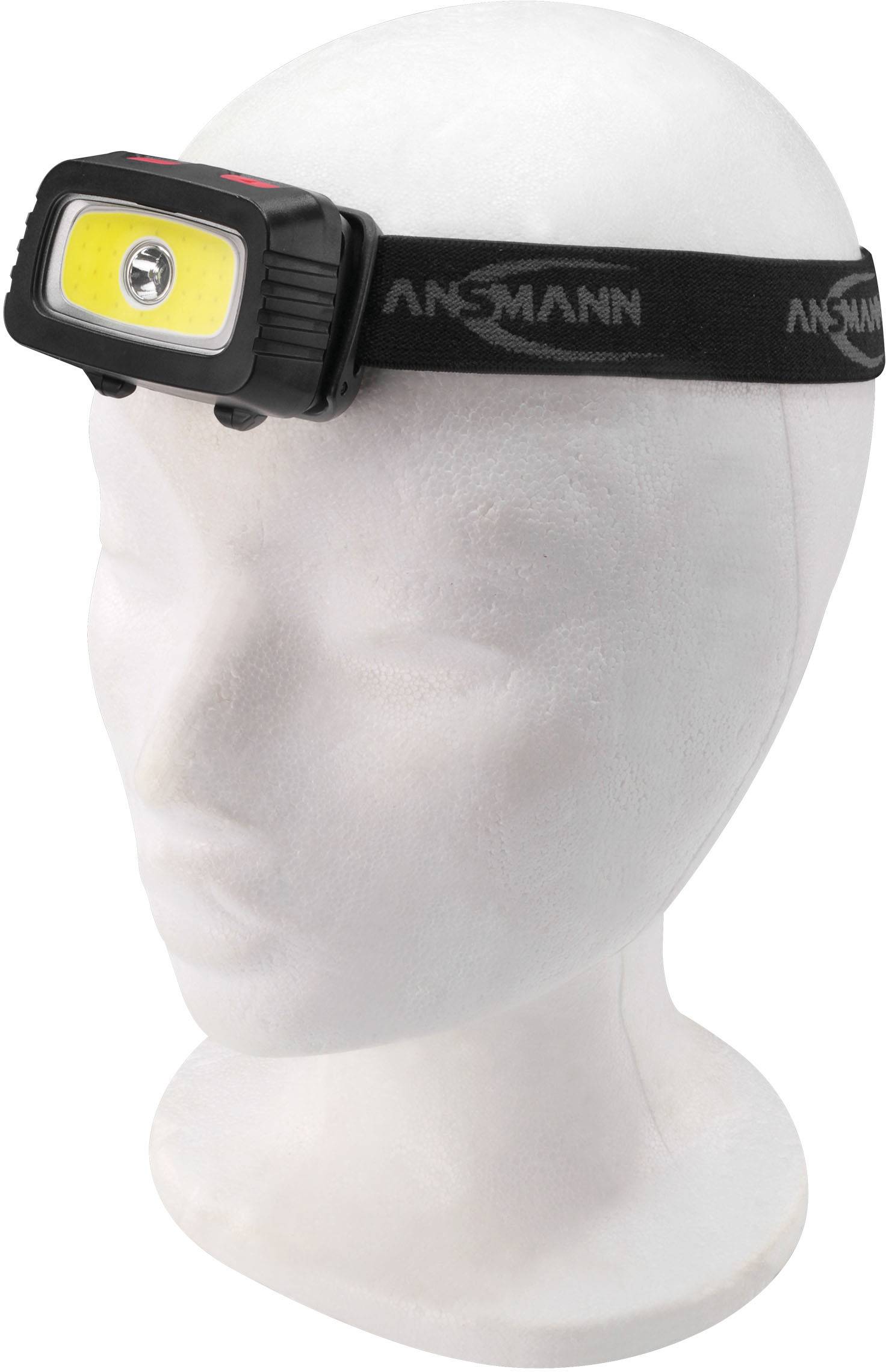 Kopflampe auf einem Mannequin-Kopf. Schwarzes Band mit gelbem LED-Licht. Geeignet für Outdoor-Aktivitäten bei Dunkelheit.