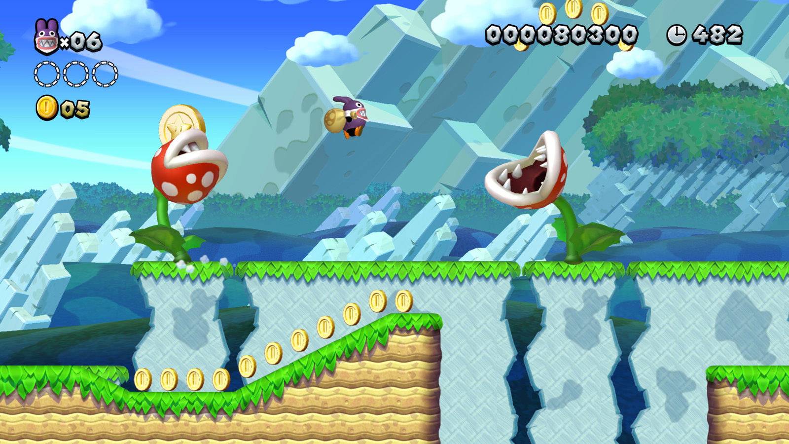 Ein Spielfigur springt über eine Schlucht mit Münzen und zwei großen, bissigen Pflanzen in einem Videospiel-Level.