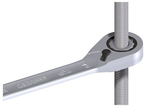 Ein Ratschenschlüssel, der eine Schraube an einer Gewindestange einstellt, demonstriert das Werkzeug beim Festziehen oder Lösen der Schraube.
