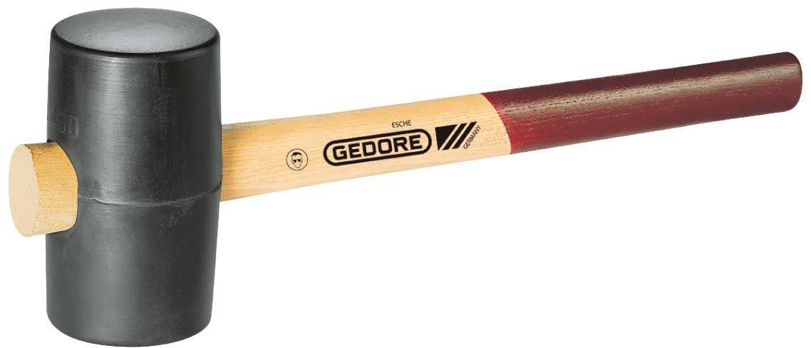 Ein schwarzer Gummihammer mit hölzernem Griff, auf dem der Markenname 'GEDORE' steht.