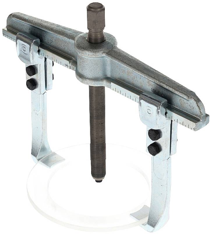 Ein metallischer Abzieher mit zwei Armen und einer zentralen Schraube zur Entfernung festsitzender Teile von Achsen oder Wellen.