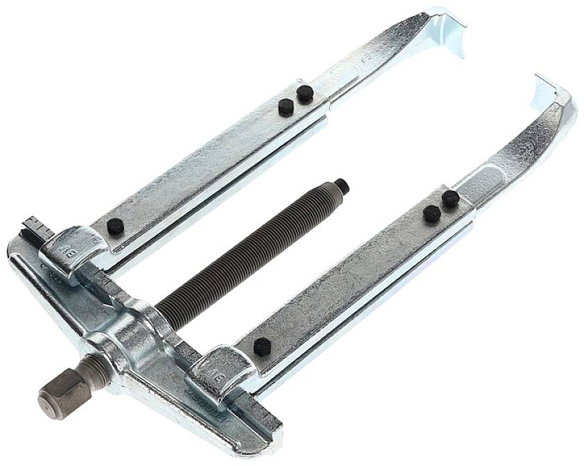 Ein metallischer Abzieher mit zwei Armen, einer zentralen Schraube und einem Griff. Wird verwendet, um Teile von Achsen zu entfernen.