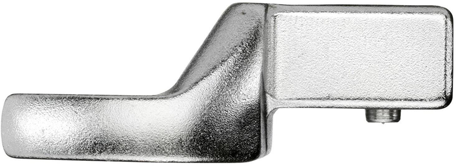 Metallisches Bauteil mit gebogener Oberfläche und einer rechteckigen, flachen Fläche. Sichtbar ist auch eine Gewindeschraube an der Seite.