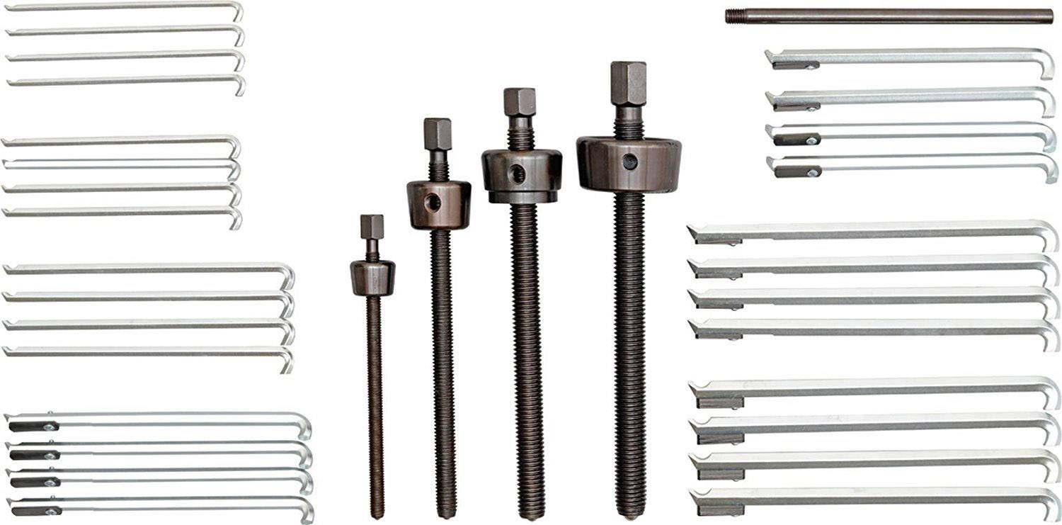 Verschiedene Abzieher-Sets: Drei Schraubabzieher in der Mitte, umgeben von mehreren Haken verschiedener Größen für mechanische Arbeiten.