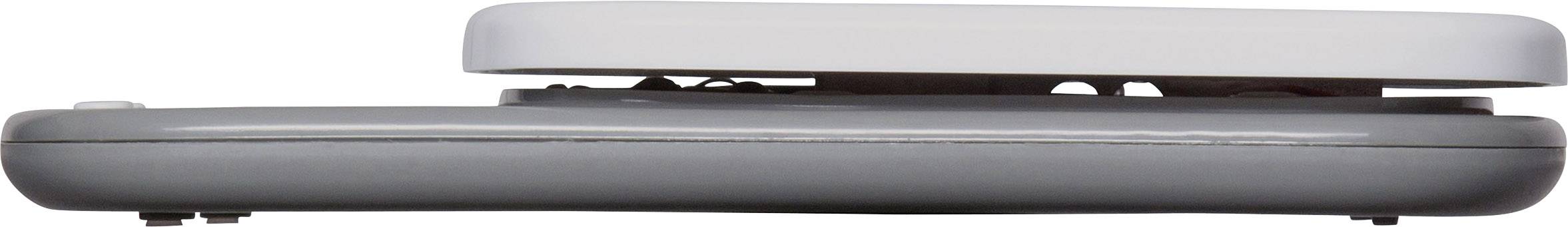 Das Bild zeigt eine Seitenansicht eines zusammengeklappten Laptops mit grauer Unterseite und heller Oberseite.