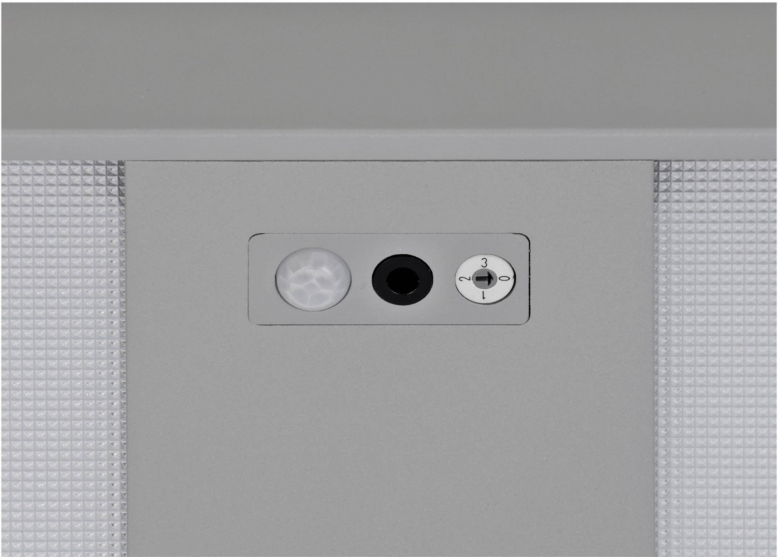 Grauer Bewegungssensor, Mikrofon und Lautstärkeregler auf einem Gerät.