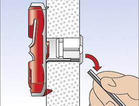 Ein Diagramm zeigt eine rote Sicherheitserdungsschraube, die mit einem Schraubendreher in eine Wand eingeschraubt wird.