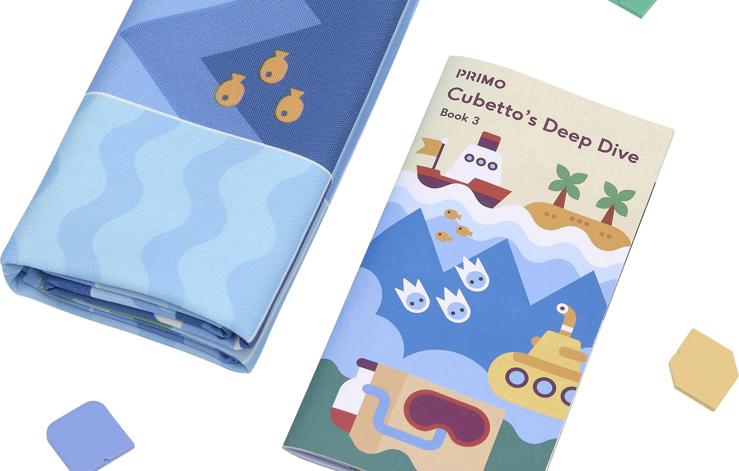 Spielmatte mit maritimem Motiv und Buch 'Cubetto's Deep Dive' neben geometrischen Formen.