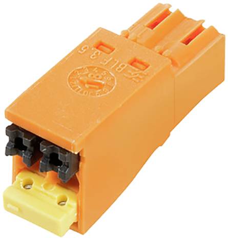 Oranger Vierwegeklemme mit zwei schwarzen Anschlussöffnungen und einem gelben Sockel, verwendet für elektrische Verbindungen.