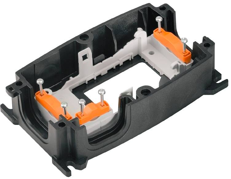 Ein schwarzes rechteckiges Kunststoffgehäuse mit orangefarbenen Einsätzen und silbernen Stiften, vermutlich ein technisches Bauteil.