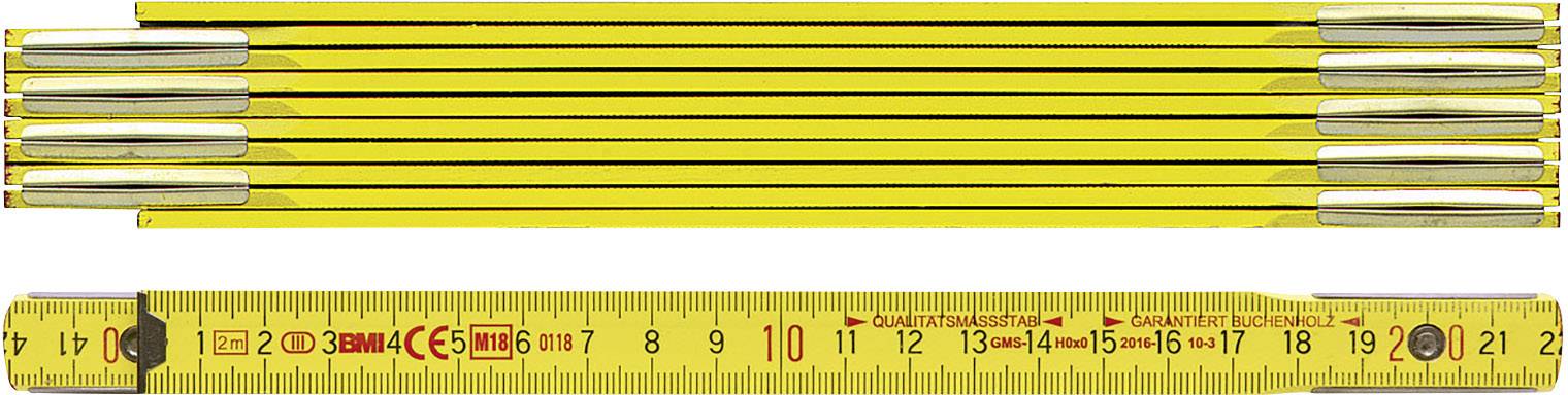 Gelber Zollstock ausgebreitet und ausgeklappt, zeigt Maße in Zentimetern und Zoll.