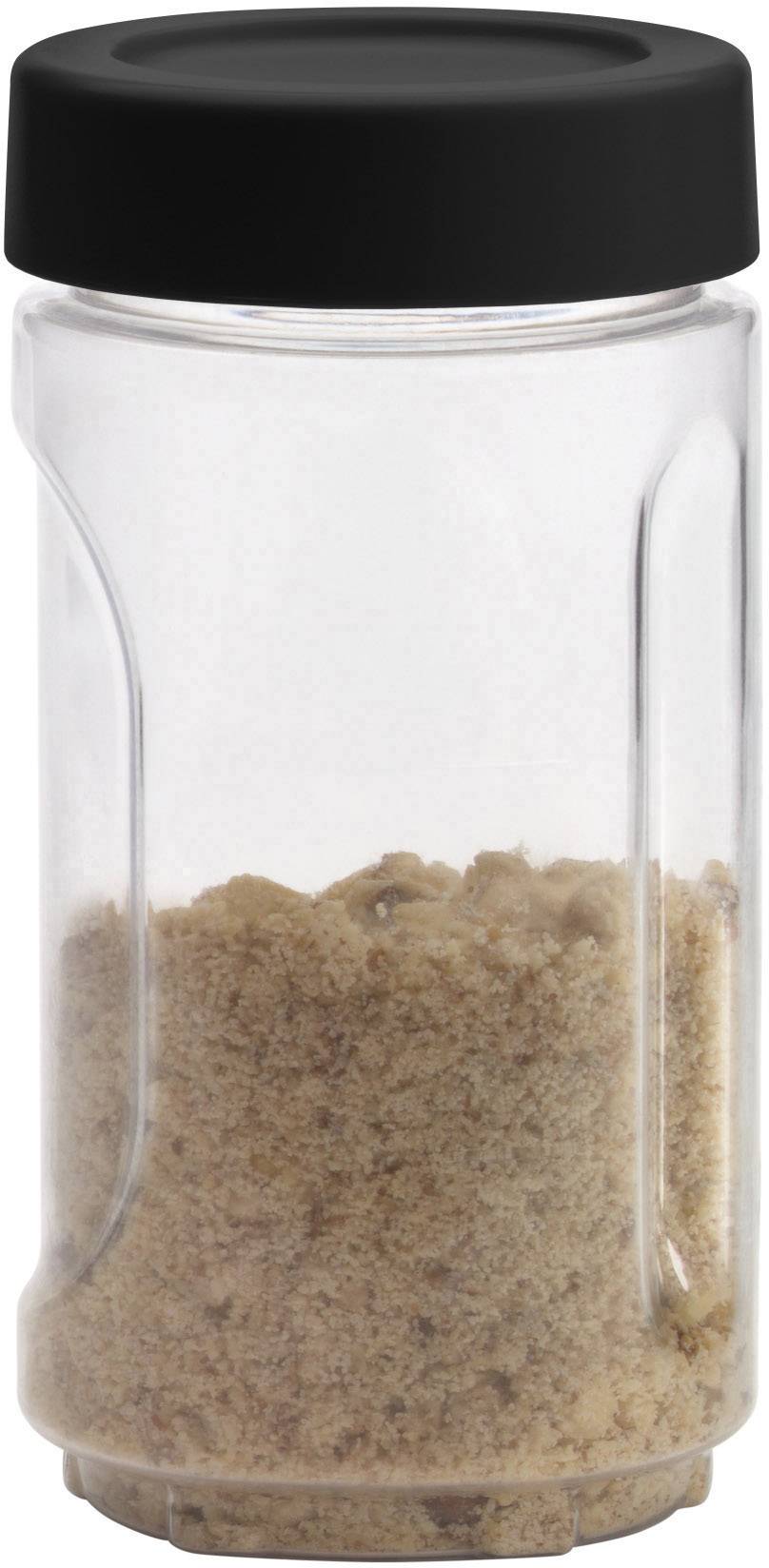 Ein transparentes Glas mit schwarzem Deckel, das mit braunem Zucker gefüllt ist.