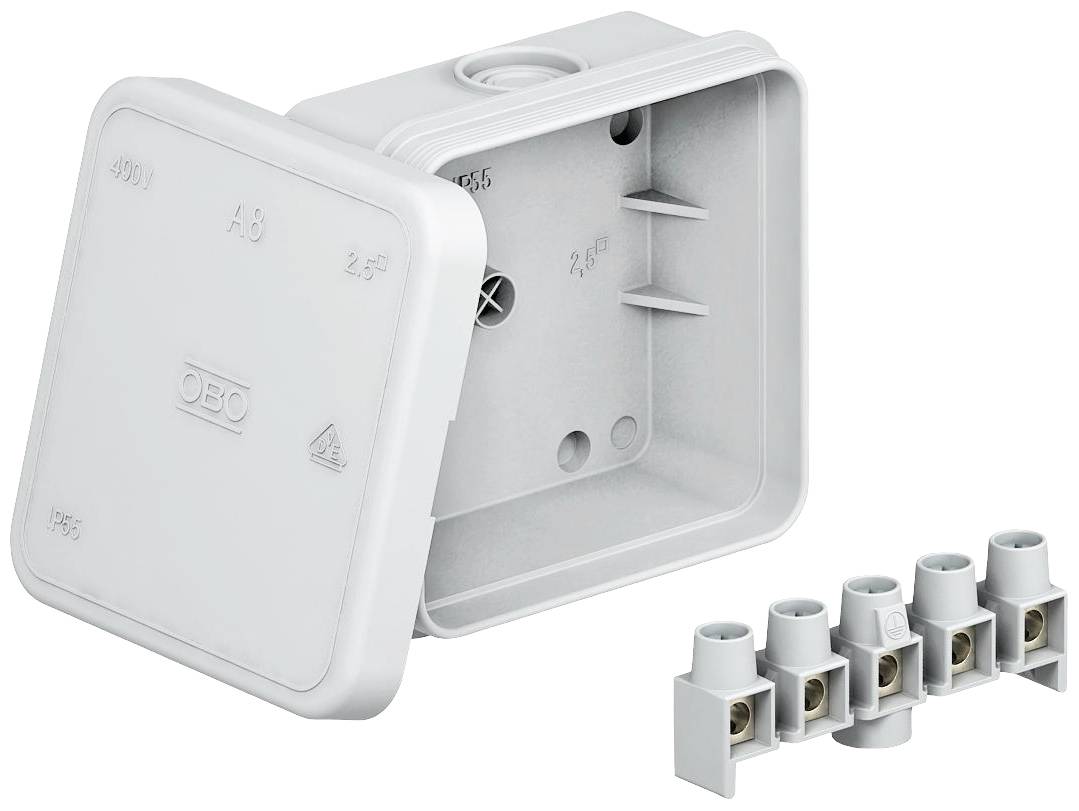 Eine graue, quadratische Elektro-Verteilerdose mit abnehmbarem Deckel, daneben ein weißer Anschlussblock für Kabelverbindungen.