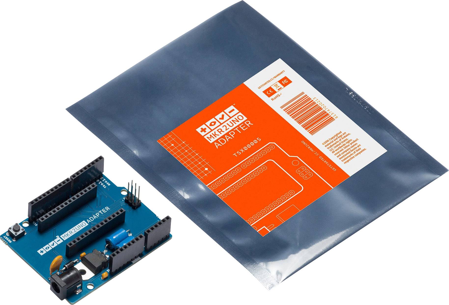 Arduino MKR2UNO Adapter neben grauem Beutel mit orangefarbenem Etikett und Spezifikationen. Adapter zur Verbindung von Arduino-Boards.
