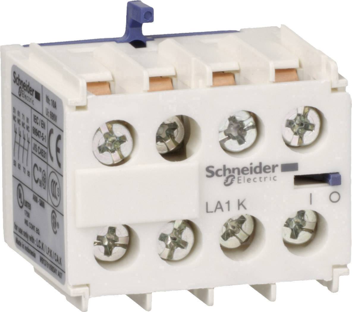'Schneider Electric LA1 K' wird auf einem elektrischen Kontaktblock gezeigt. Der Block hat mehrere Schraubklemmen und ist weiß.