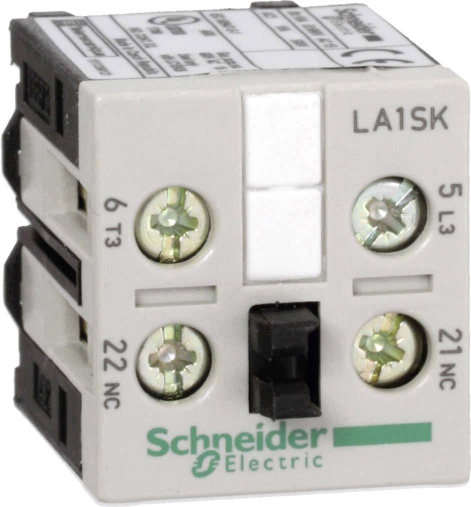 Ein weißes elektrisches Schütz von Schneider Electric mit Modellnummer LA1SK, frontale Ansicht mit vier Schraubklemmen sichtbar.