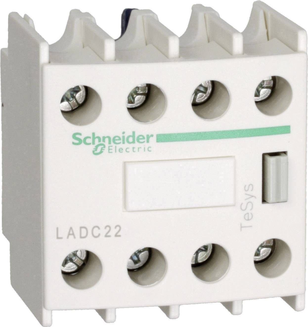 Ein weißer, rechteckiger elektrischer Schalter mit drei Schraubklemmen oben, dem Logo 'Schneider Electric' und der Beschriftung 'TeSys'.